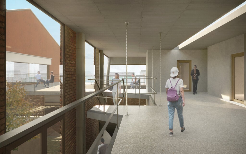 A circulação interna da EMAET enquadra visuais do Clube dos Ferroviários assim como do casario da Vila Belga. Ao fundo, observa-se o terraço visitável que estabelece uma relação interativa entre as edificações.