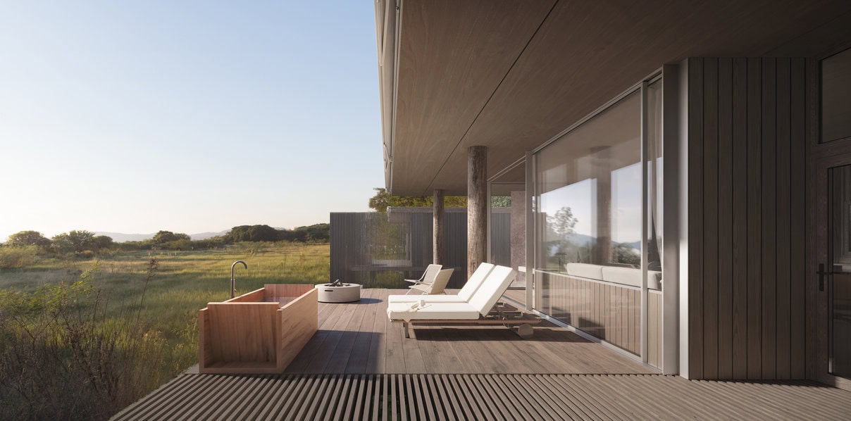 O deck externo, protegido visualmente pelas empenas laterais, oferece um espaço de estar com relação direta ao Lago.